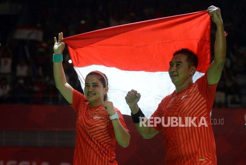 Pebulu tangkis Indonesia Leani Ratri Oktila dan Hary Susanto (ilustrasi). Hary/Ratri meraih emas pada Paralimpiade 2020.