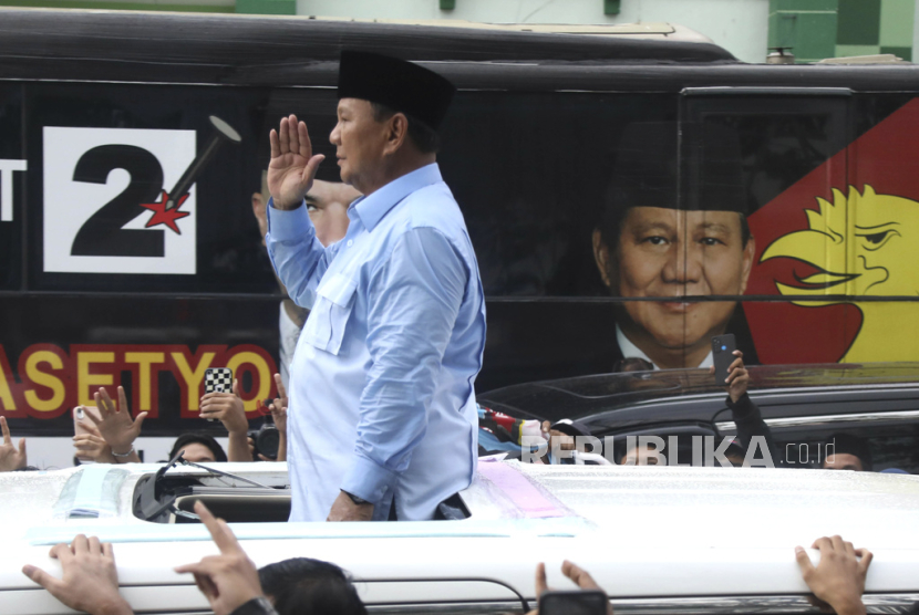 Indonesian presidential candidate Prabowo Subianto salutes during his campaign rally in Sidoarjo, East Java, Indonesia, Friday, Feb. 9, 2024. The world