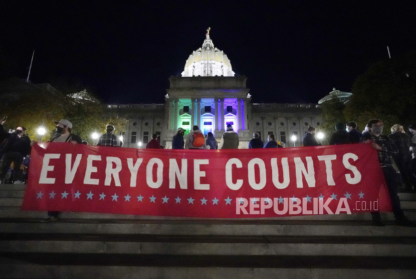 People demonstrate outside the Pennsylvania State Capitol to urge that all votes be counted, Wednesday, Nov. 4, 2020, in Harrisburg, Pa., following Tuesday