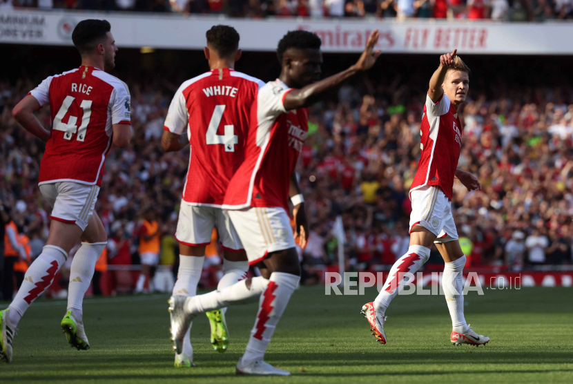 Para pemain Arsenal melakukan selebrasi usai mencetak gol di ajang Liga Champions.