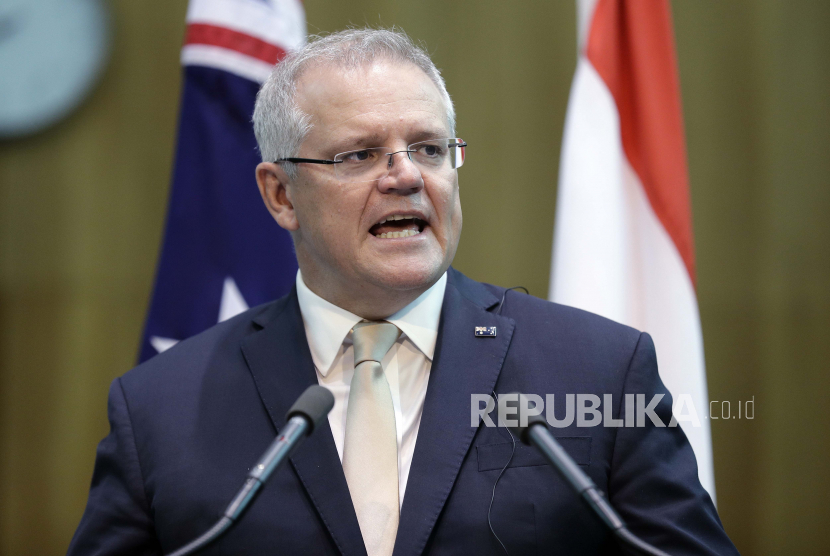  Perdana Menteri Australia Scott Morrison membuat pernyataan bersama dengan Presiden Indonesia Joko Widodo di Gedung Parlemen di Canberra, Australia. Morrison pada hari Senin, 29 Maret 2021, 