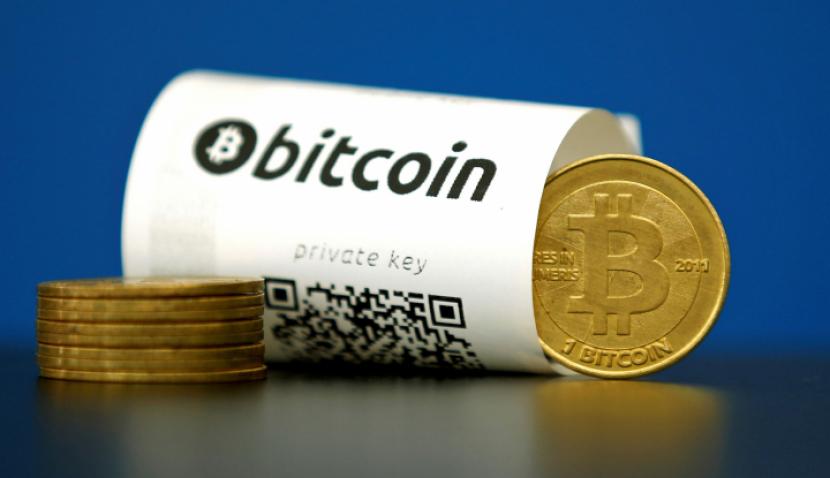 Aset Kapitalisasi Pasar Bitcoin Terbang Tinggi, PayPal Ketendang. (FOTO: Reuters/Benoit Tessier)