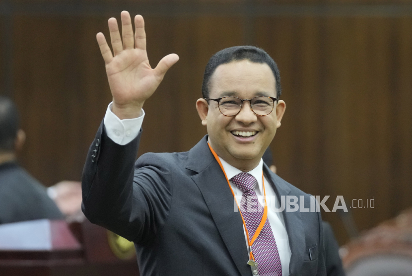 Losing presidential candidate Anies Baswedan waves at the media prior to the start of the first hearing of his legal challenge to the Feb. 14 presidential election alleging widespread fraud, at the Constitutional Court in Jakarta, Indonesia, Wednesday, March 27, 2024. Defense Minister Prabowo Subianto, who chose the son of the popular outgoing President Joko Widodo as his running mate, won the election by 58.6% of the votes, according to final results released by the Election Commission. 
