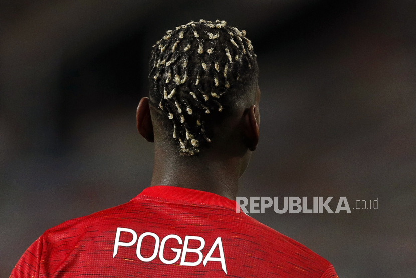  Reaksi Paul Pogba dari Manchester United saat pertandingan sepak bola putaran keempat Piala FA Inggris antara Manchester United dan Liverpool di Manchester, Inggris, 24 Januari 2021.