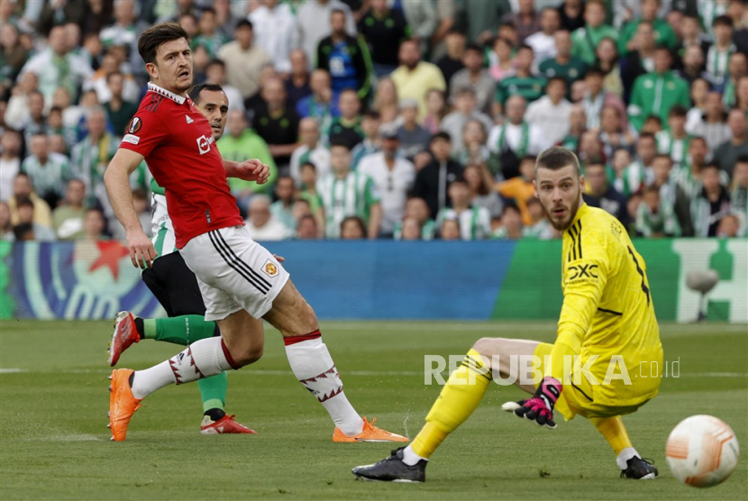 Betis Joanmi (back) in action against Manchester United