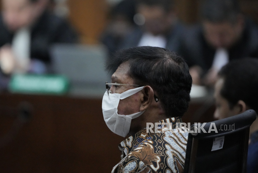 Former Indonesian Communication and Information Minister Johnny G. Plate sits on the defendant
