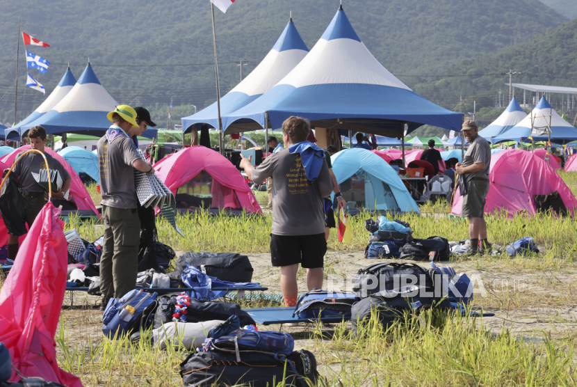 U.S. scout members prepare to leave the World Scout Jamboree campsite in Buan, South Korea, Sunday, Aug. 6, 2023. South Korea is plowing ahead with the World Scout Jamboree, rejecting a call by the world scouting body to cut the event short as a punishing heat wave caused thousands of British scouts to begin leaving the coastal campsite Saturday. American scouts are expected to leave over the weekend. 