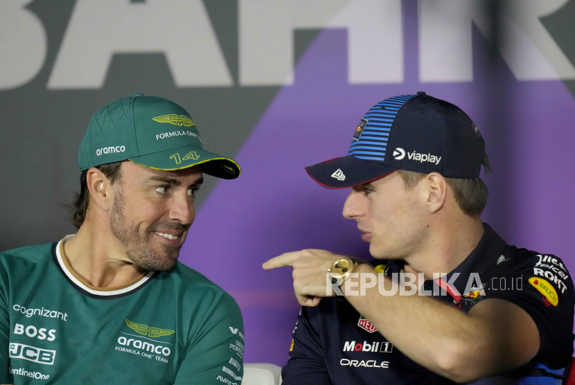 Aston Martin driver Fernando Alonso of Spain, left, speaks with Red Bull driver Max Verstappen of the Netherlands during a media conference ahead of the Formula One Bahrain Grand Prix at the Bahrain International Circuit in Sakhir, Bahrain, Wednesday, Feb. 28, 2024.  