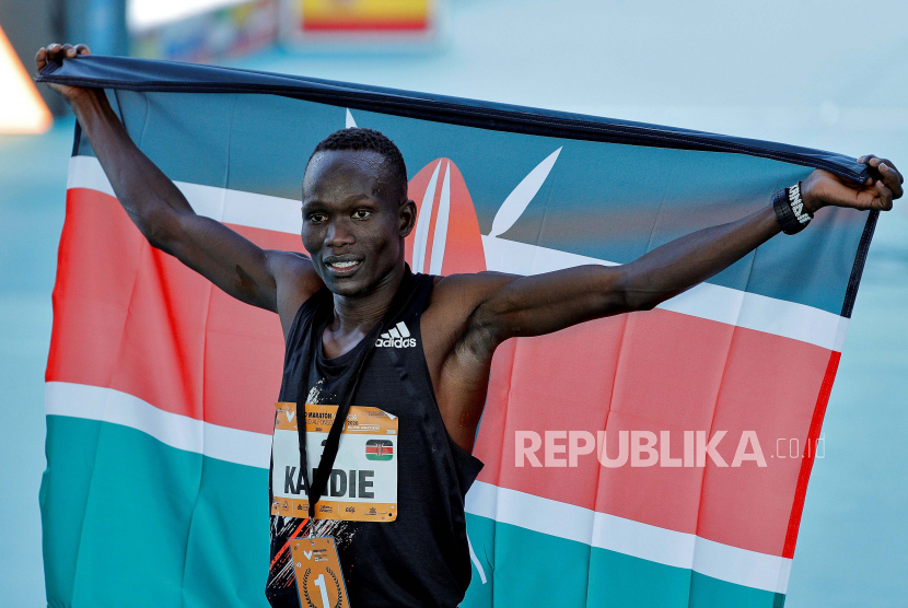 Kenyan athlete Kibiwott Kandie (C) celebrates shortly after he broke the World record, while winning the Valencia Half Marathon, in Valencia, Spain, 06 December 2020.  