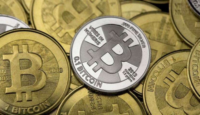 Some of Bitcoin enthusiast Mike Caldwell's coins are pictured at his office in this photo illustration in Sandy, Utah, January 31, 2014. (Reuters/Jim Urquhart)