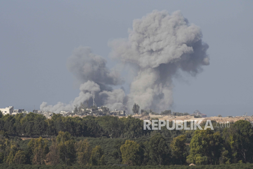 Smoke rises following an Israeli bombardment in the Gaza Strip, as seen from southern Israel on Monday, Dec. 4, 2023.  