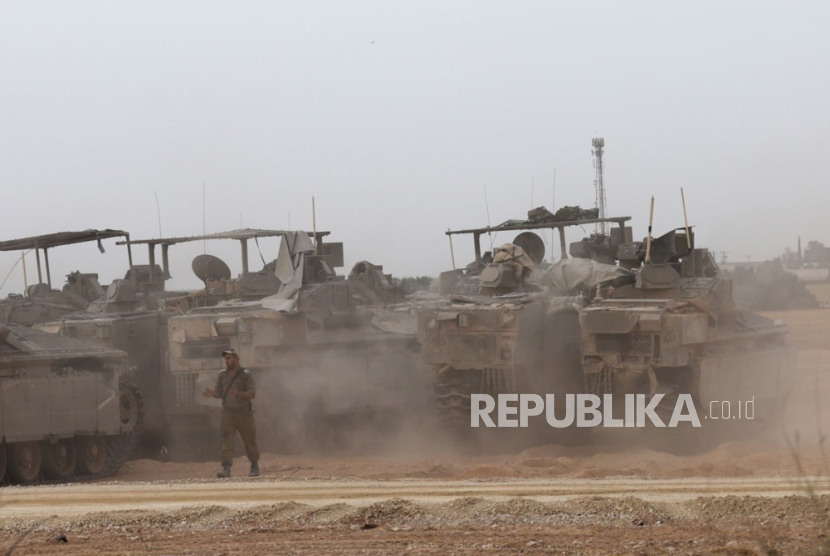 Israeli APCs at a gathering location on the southern Israeli border with the Gaza Strip near Rafah, 25 April 2024. More than 34,000 Palestinians and over 1,450 Israelis have been killed, according to the Palestinian Health Ministry and the Israel Defense Forces (IDF), since Hamas militants launched an attack against Israel from the Gaza Strip on 07 October 2023, and the Israeli operations in Gaza and the West Bank which followed it.  