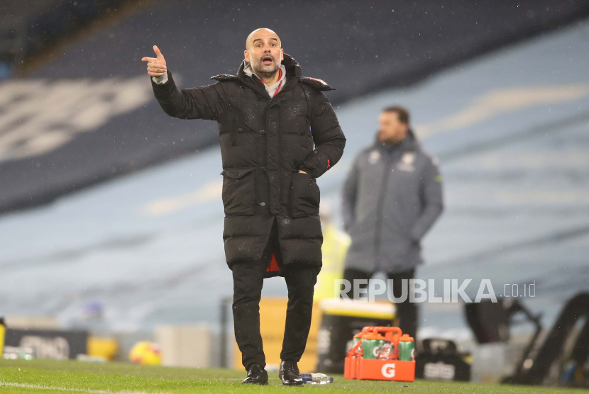 Head coach Josep Guardiola of Manchester City reacts during the English Premier League soccer match between Manchester City and Aston Villa in Manchester