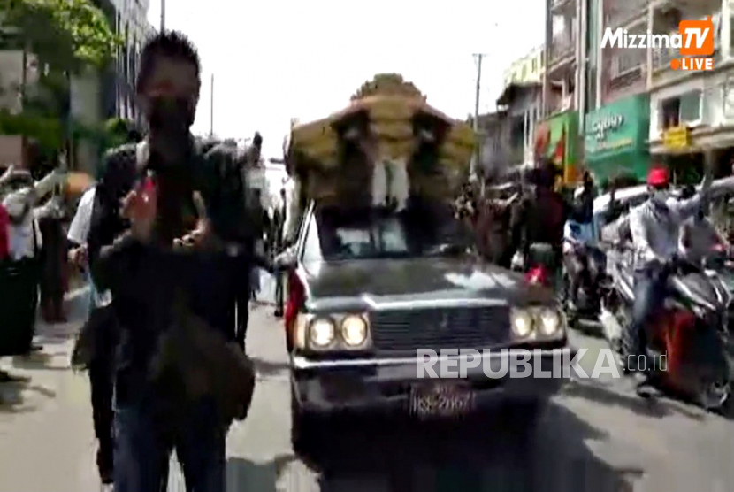 Funeral procession for 19-year old protester Angel, also known as Kyal Sin, who was killed during protests on Wednesday, in this still image from social media video, in Mandalay, Myanmar March 4, 2021. 