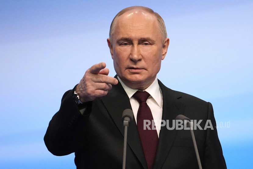 Russian President Vladimir Putin speaks on a visit to his campaign headquarters after a presidential election in Moscow, early Monday, March 18, 2024.  
