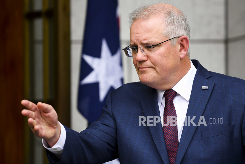  Perdana Menteri Australia Scott Morrison berbicara kepada media selama konferensi pers mengenai wabah COVID-19 di New South Wales, di Gedung Parlemen di Canberra, Australia, 21 Desember 2020.