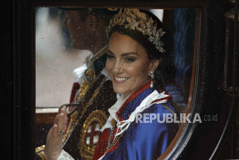 FILE - Kate, Princess of Wales and Prince William travel in a coach following the coronation ceremony of Britain