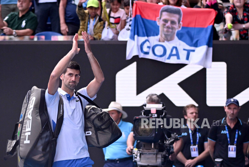   Novak Djokovic of Serbia waves to the crowd as he leaves the court following his loss in the Men’s semifinal to Jannik Sinner of Italy on Day 13 of the 2024 Australian Open at Melbourne Park in Melbourne, Australia 26 January 2024.   