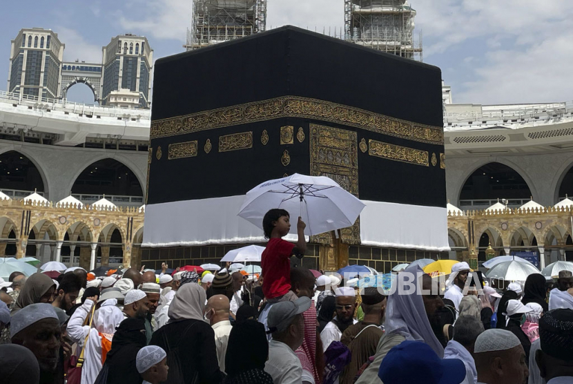 Muslim pilgrims circumambulate the Kaaba, the cubic building at the Grand Mosque, during the annual Hajj pilgrimage, in Mecca, Saudi Arabia, Saturday, July 1, 2023.