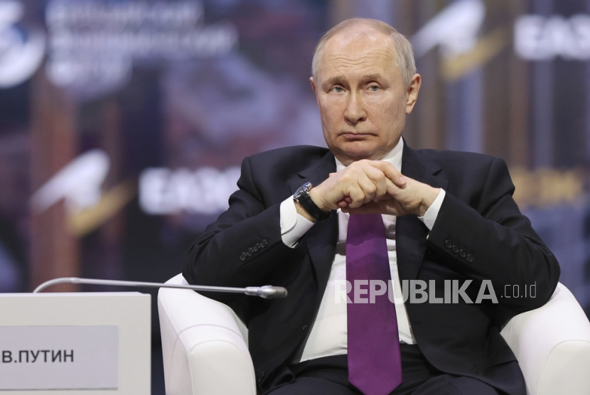 In this handout photo released by Roscongress Foundation, Russian President Vladimir Putin attends the plenary session of the Eurasian Economic Forum in Moscow, Russia, Wednesday, May 24, 2023. 