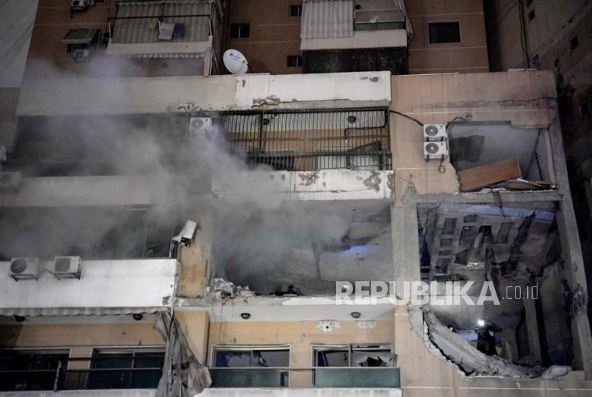 Smoke billows from a destroyed building at the site of an explosion in the southern district of Dahiyeh, Beirut, Lebanon, 02 January 2024. According to Lebanese state media, at least six people were killed in an explosion following an Israeli drone strike, including Hamas deputy head, Saleh al-Arouri.  