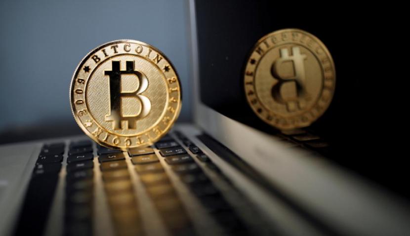 A Bitcoin (virtual currency) coin is seen in an illustration picture taken at La Maison du Bitcoin in Paris, France, June 23, 2017. (Reuters/Benoit Tessier)