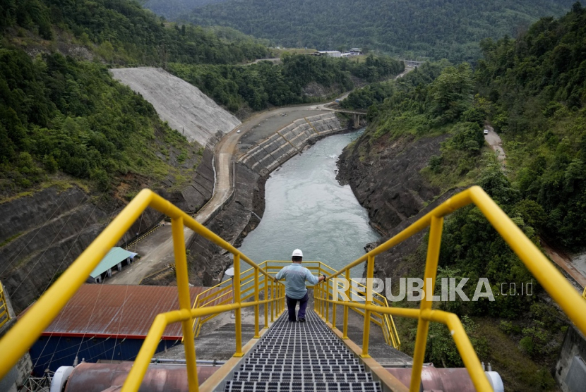 An employee walks down a stairway at Balambano hydroelectric plant, one of three dams that power PT Vale Indonesia