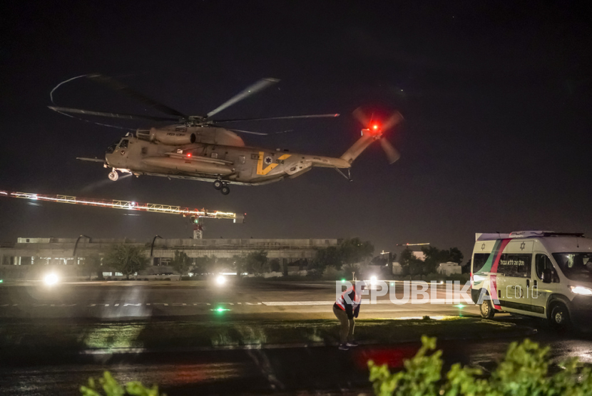A helicopter carrying Israeli hostages released by Hamas lands at the Sheba Medical Center in Ramat Gan, Israel, early Thursday, Nov. 30, 2023. International mediators on Wednesday worked to extend the truce in Gaza, encouraging Hamas militants to keep freeing hostages in exchange for the release of Palestinian prisoners and further relief from Israel