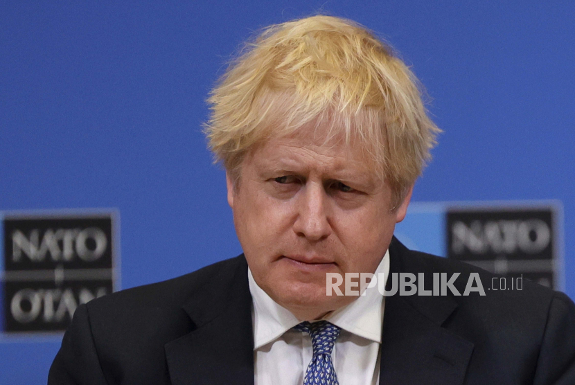 British Prime Minister Boris Johnson listens to questions during a media conference with NATO Secretary General Jens Stoltenberg at NATO headquarters in Brussels, Thursday, Feb. 10, 2022. 