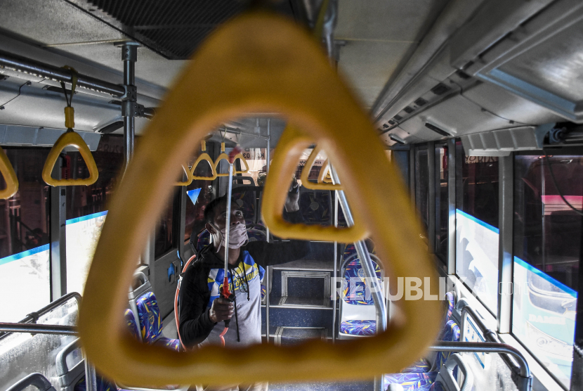 Officers are spraying disinfectant liquid in the area of ​​Trans Metro Bandung bus in Cicaheum Terminal, Bandung City, West Java, Indonesia. The death toll of coronavirus is increasing in Indonesia.