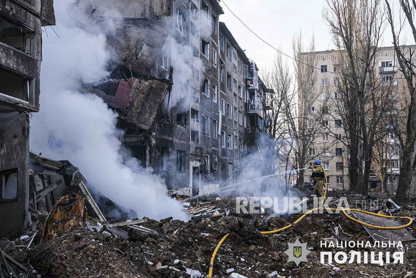  A handout photo made available by the National Police of Ukraine, shows the site of a shelling on a residential building in Selidove city of Donetsk area, Ukraine, 14 February 2024 amid the Russian invasion. At least three people were killed and another 12 were injured following a Russian strike on a five-floor residential building, and a part of a civilian hospital according to the State Emergency Service. according to the State Emergency Service.   