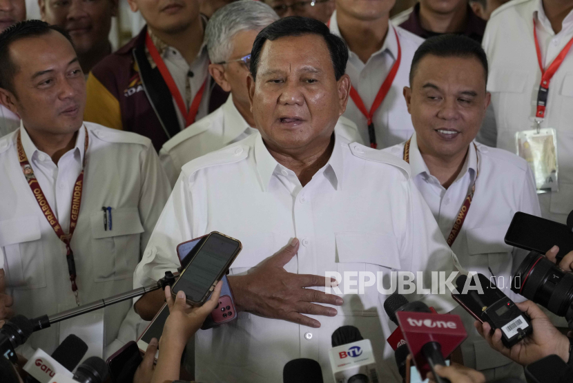 Indonesian presidential hopeful and Defense Minister Prabowo Subianto, center, gestures during a press conference in Jakarta, Indonesia, Monday, Oct. 23, 2023. The world