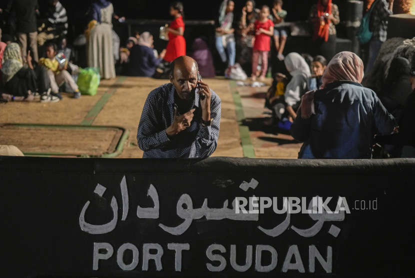 A Sudanese evacuee waits at Port Sudan before boarding a Saudi military ship to Jeddah port, Wednesday, May 3, 2023. Exhausted Sudanese and foreigners joined growing crowds at Sudan