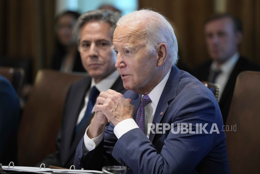 President Joe Biden speaks during a meeting with his Cabinet in the Cabinet Room of the White House in Washington, Monday, Oct. 2, 2023. Secretary of State Antony Blinken looks on at left. 