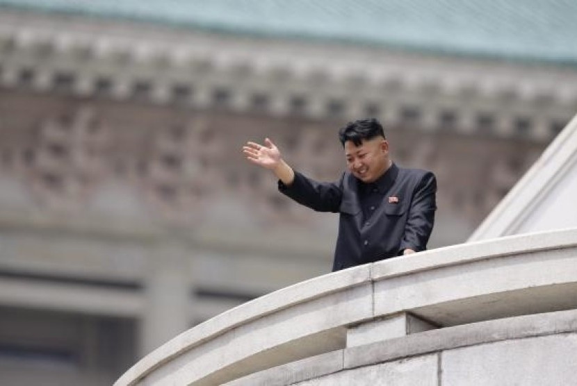 North Korean leader Kim Jong-un waves to the people during a parade to commemorate the 60th anniversary of the signing of a truce in the 1950-1953 Korean War, at Kim Il-sung Square in Pyongyang July 27, 2013.