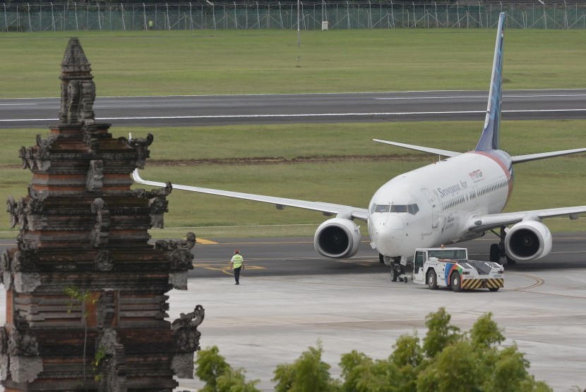 Pesawat udara berada di kawasan Bandara Internasional I Gusti Ngurah Rai, Bali, Jumat (8/3/2019). 