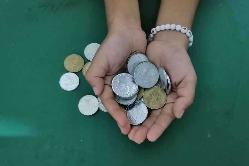 Uang koin rupiah. Bank Indonesia menegaskan uang koin/logam merupakan alat pembayaran yang sah.
