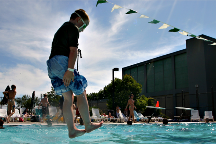 A boy jumps into a pool in Seattle. (illustration)