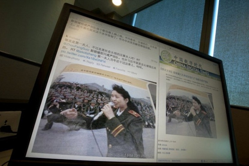 A computer screen shows websites displaying an undated photo of China’s new first lady Peng Liyuan in younger days singing to martial law troops following the 1989 bloody military crackdown.