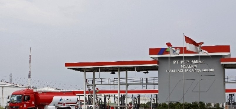 A fuel truck passes a service station at Plumpang, North Jakarta.   