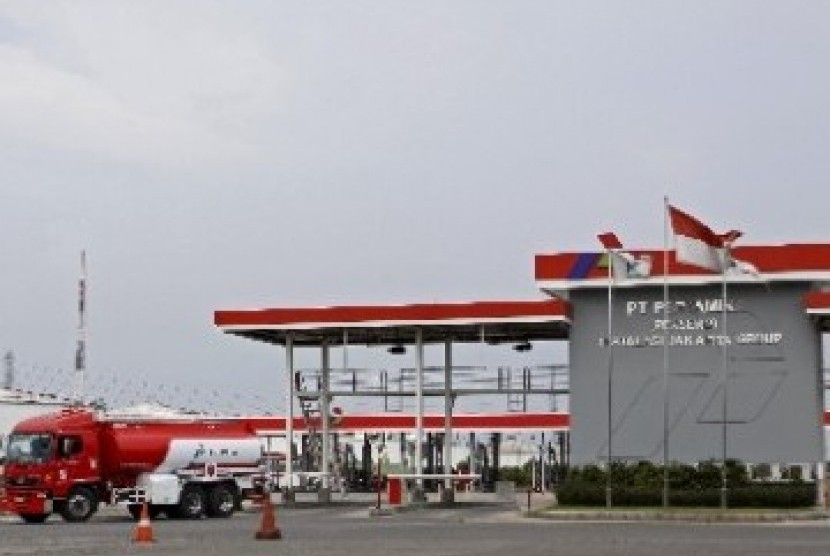 A fuel truck passes a service station at Plumpang, North Jakarta.   