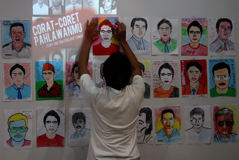 A man posts pictures of victims died in accidence related to human right violation on Monday.  