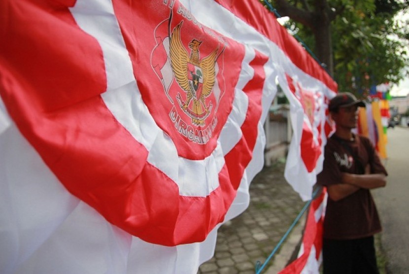 A man sells Indonesian flag in a street in Gorontalo, Sulawesi. (illustration)  