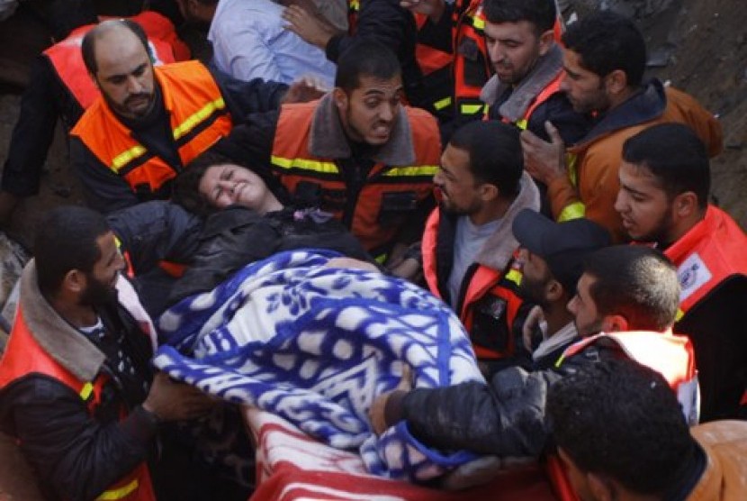 A member of the Abdel Aal family is rescued after his family house collapsed during an Israeli forces strike in the Tufah neighbourhood, Gaza City, Sunday, Nov. 18, 2012.    