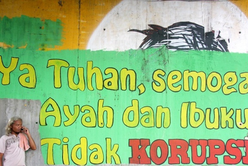 A mural with anti-corruption message is painted on the wall under the bridge in Jakarta. (illustration)