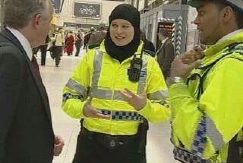 A poliwoman with headscarf in UK