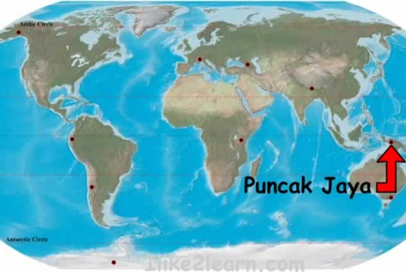 A red arrow shows the location of Puncak Jaya, where a commercial plane was shot several times on Sunday. (map) 