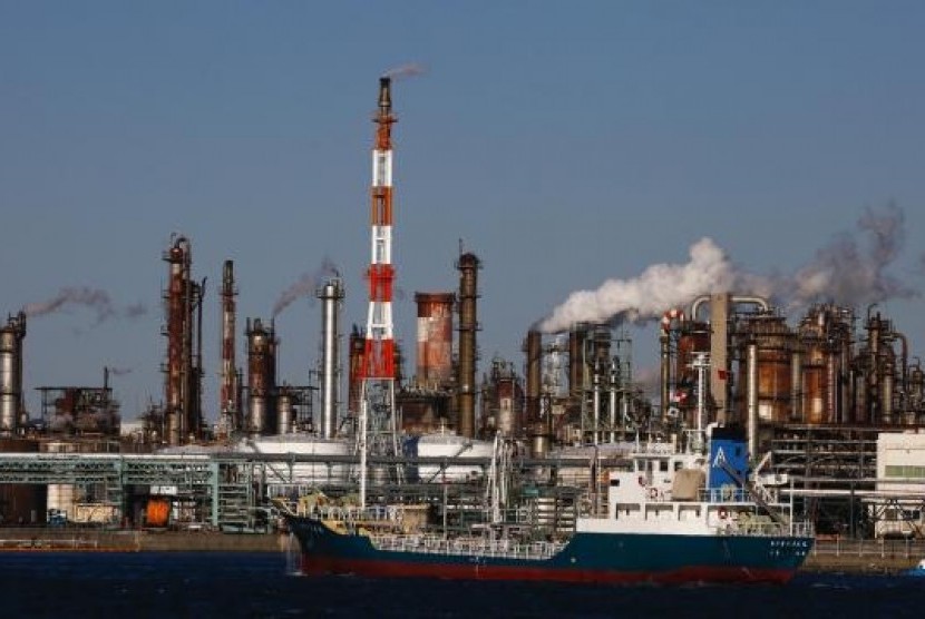 A ship passes a petro-industrial complex in Kawasaki near Tokyo December 18, 2014.