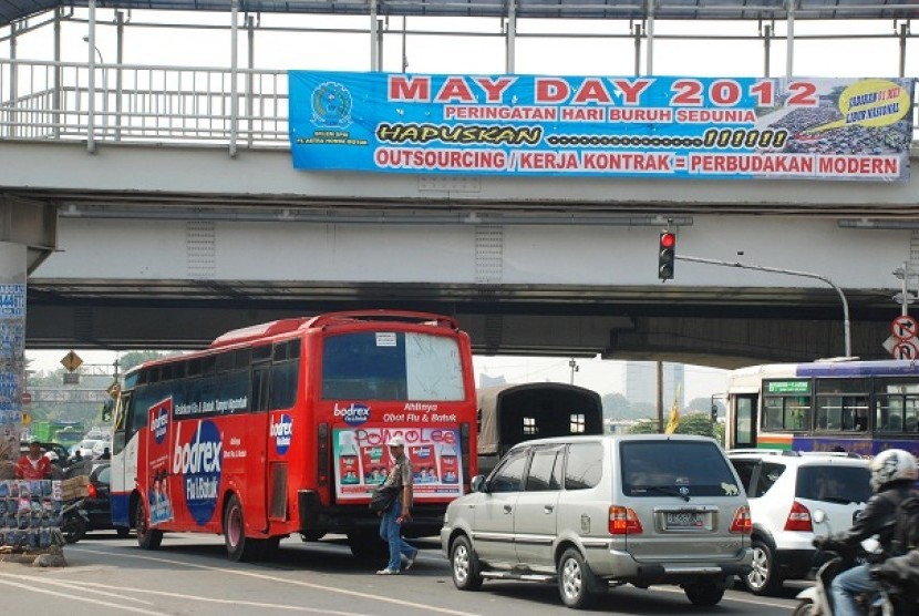 A streer banner of May Day 2012 is on display in Cempaka Putih, Jakarta.     