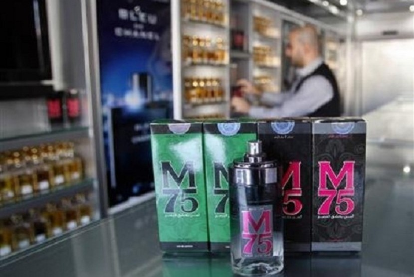 A vendor displays perfume bottles called M75 at his shop in Gaza City December 12, 2012. The Gaza vendor said the new perfume symbolises the name of the home-made M75 rocket.   